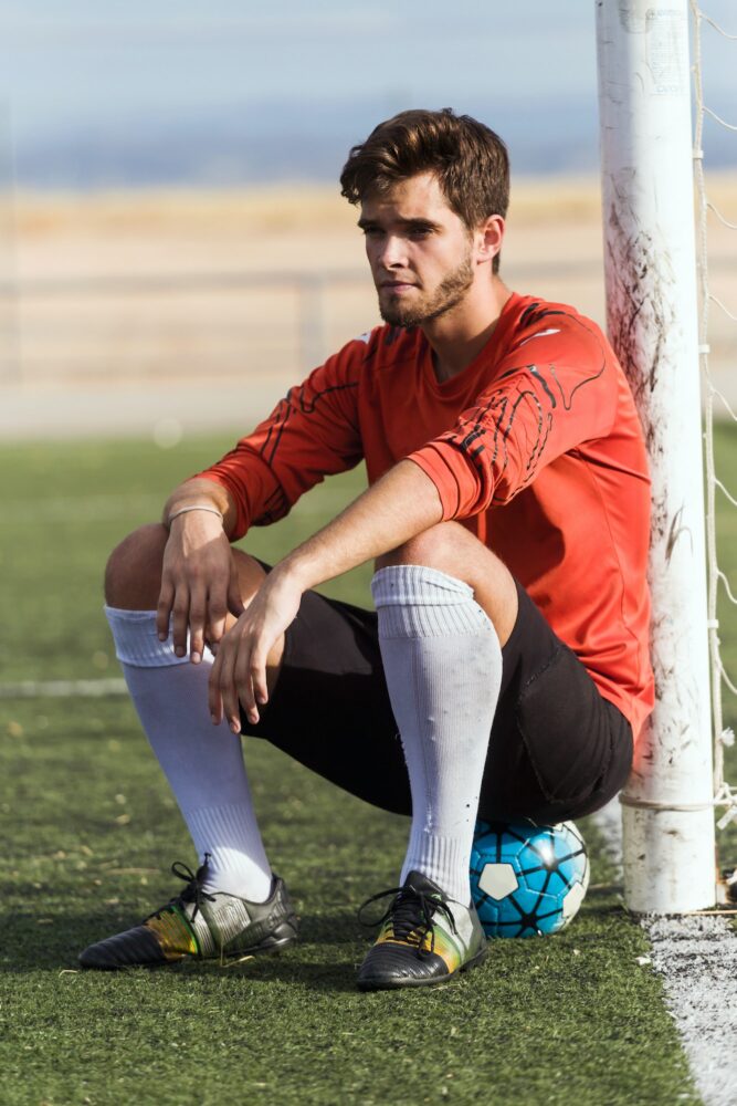Player sitting on a ball